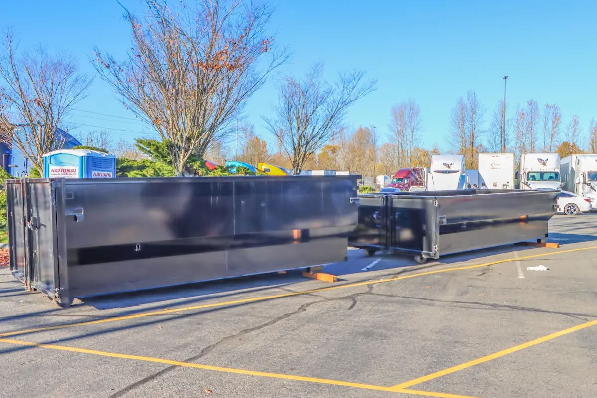 Professional dumpster rental service with roll-off container on residential driveway in New Sewickley